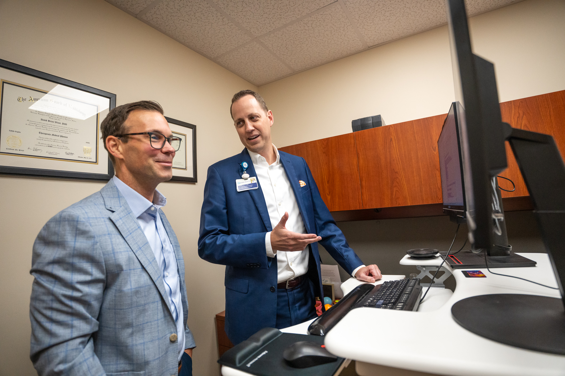 Two colleagues reviewing a clinical screen together